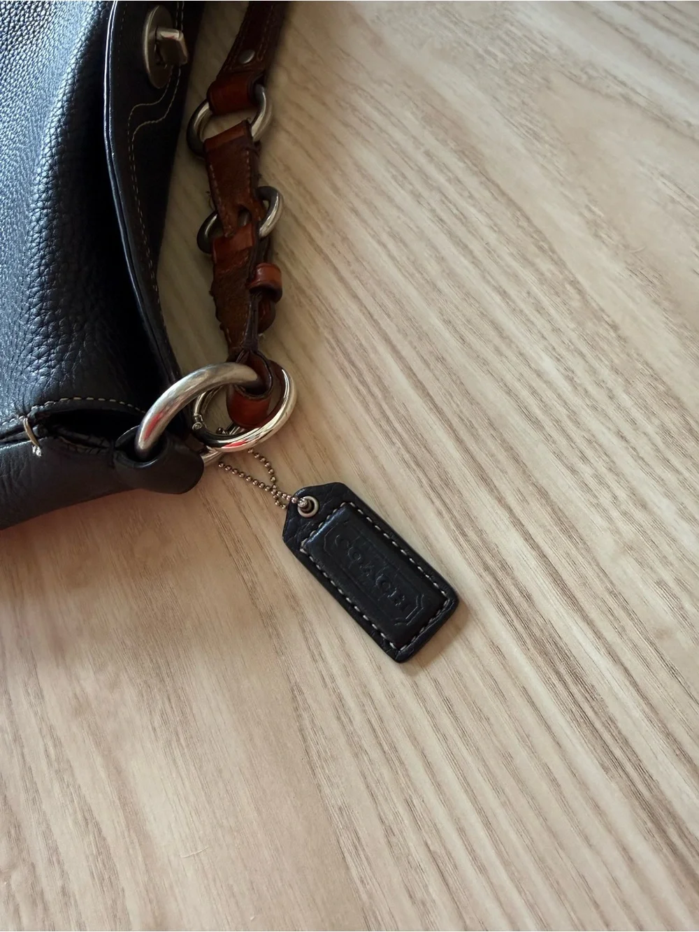 Coach Black Pebbled Leather Shoulder Bag with Brown Strap Accents